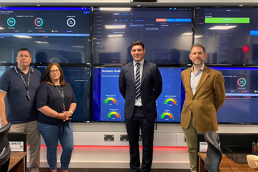 business owners pictured in front of computer screens and fund manager who has supported investment