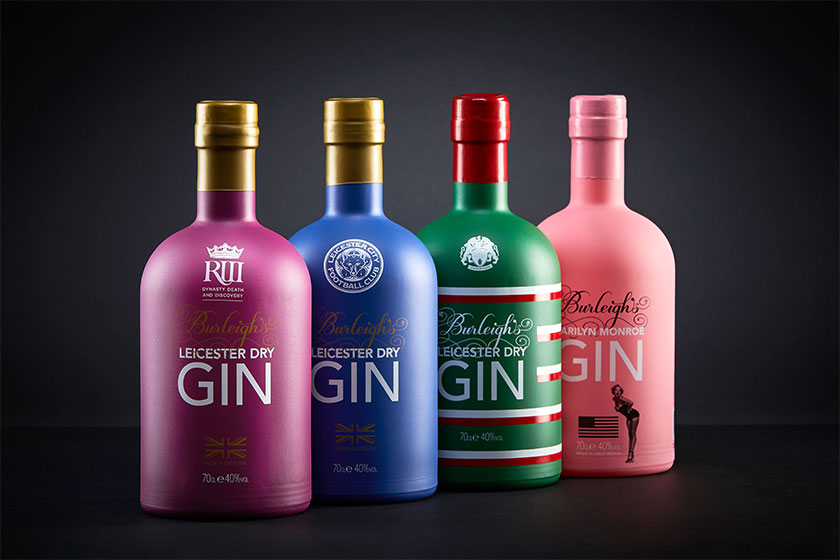 four bottles of Gin product shown