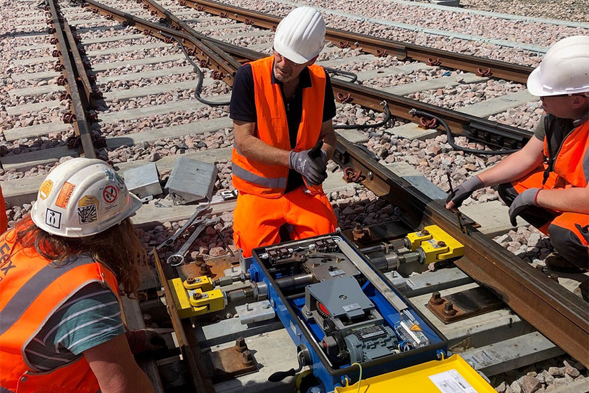 image depicts working on railway track